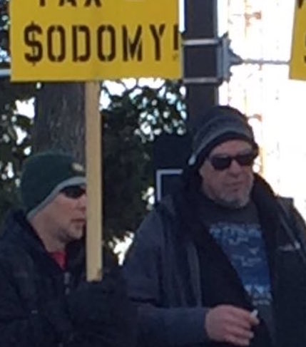 Closeup on $odomy Sign Men