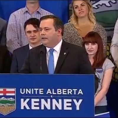 Jason Kenney makes it official with fresh-faced extras and unattributed tribute to the Nixon Era